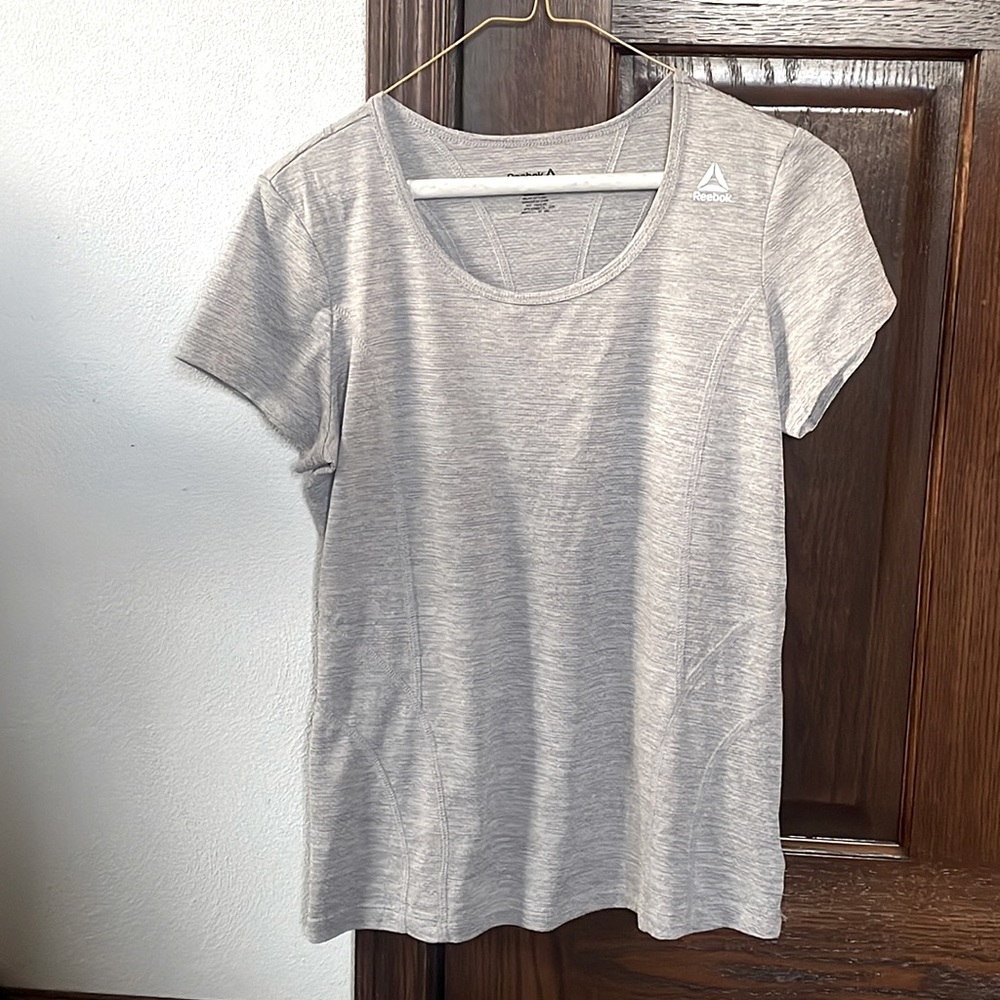 A grey Reebok shirt